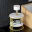 A marmo side table by riposoconcept and a lamp on it