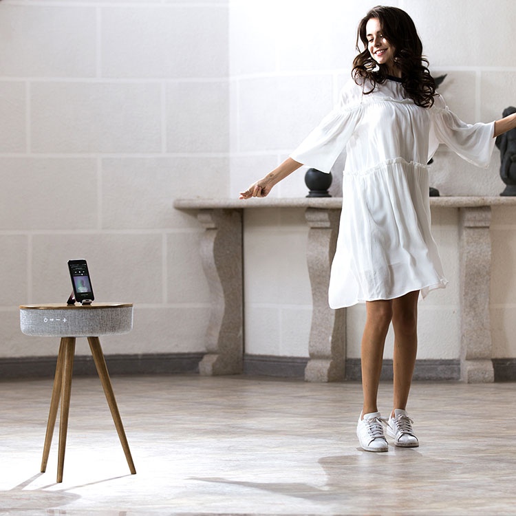 A women dancing and Brillante Table Wood on other side